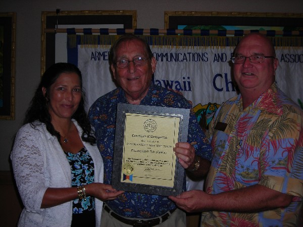 HAWAII—Chapter Chairperson Cynthia Pacheco (l) and Regional Vice President Lt. Cmdr. Ed Riglewicz, USAF (Ret.) (r) present the Distinguished Life Membership Award to Capt. Kenneth D. Wiecking, USN (Ret.) in July.